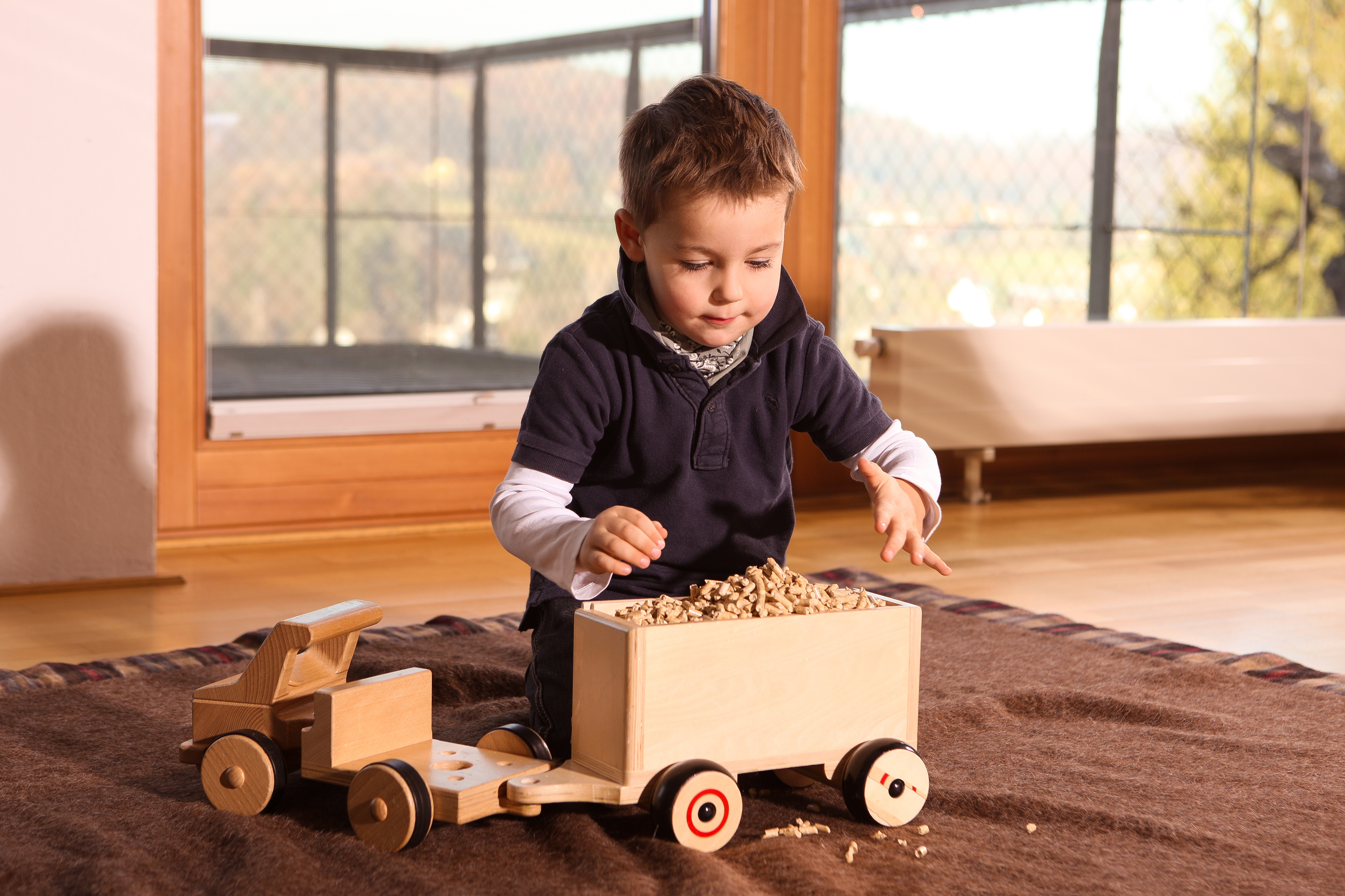 Kind Pelletzug voll beladen